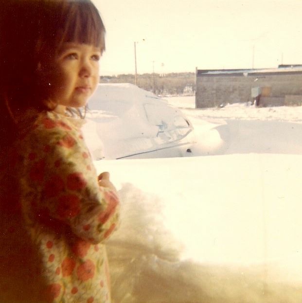 Kristy as a child in the snow